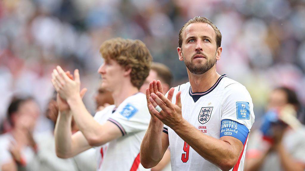 England players celebrating after qualifying for the World Cup knockout rounds